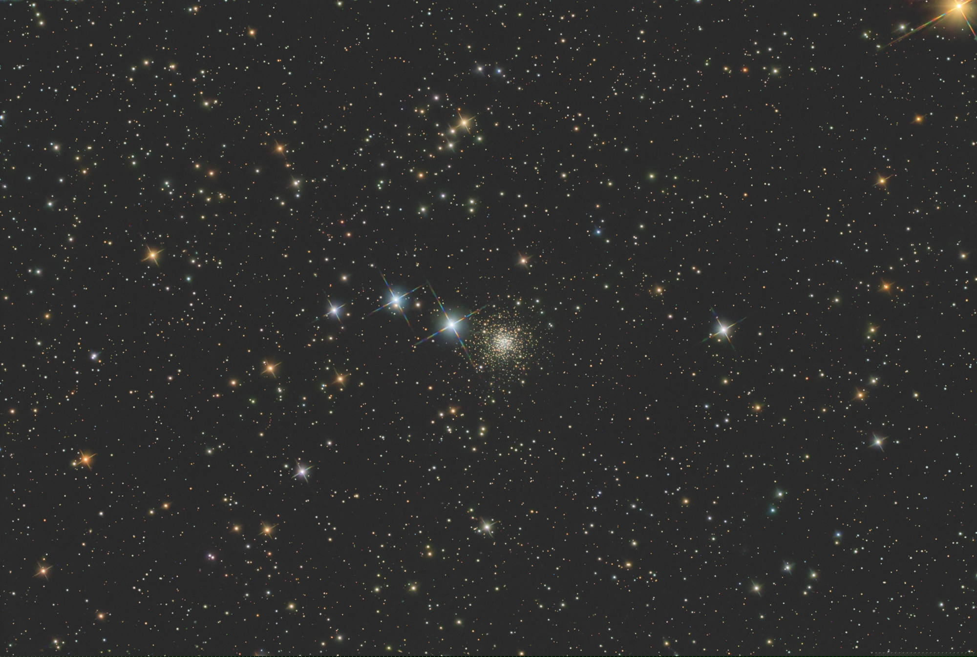 NGC 2419, also called Galactic Wanderer, is an open star cluster in the constellation of Cepheus. It is heavily reddened and contains an unusually large number of red giants and supergiants.